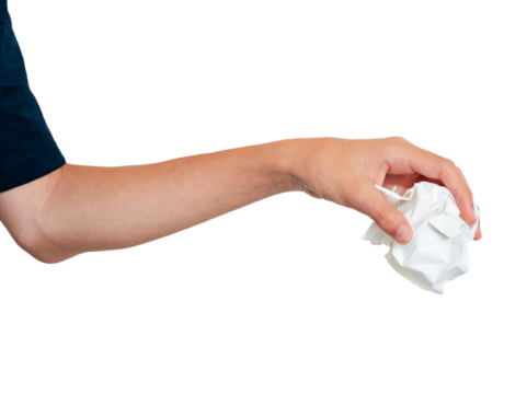 Hand holding squeezing crumbled paper isolated on a white background. Man hand throwing crumbled waste paper in an idea of to trow in recycle trash.