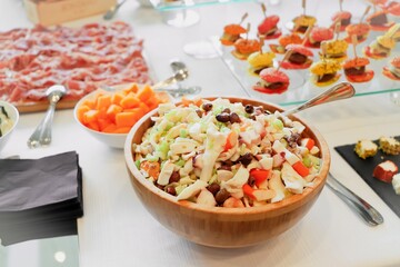 salad with tuna and vegetables. catering buffet with variety of food snacks and appetizers.