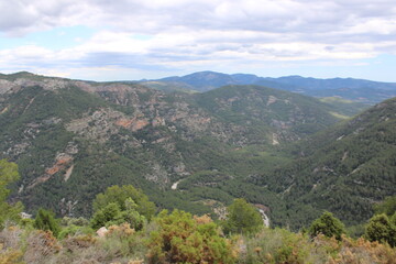 Obraz premium Mountains of El Maestrazgo, Castellón, Spain, rugged, rocky, colorful, and with trees