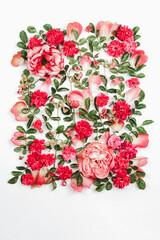 Beautiful composition of pink rose flowers and leaves. High quality photo