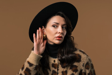 Curious mature woman doesn't hear,eavesdropping.Quiet sound, deaf, misunderstand
