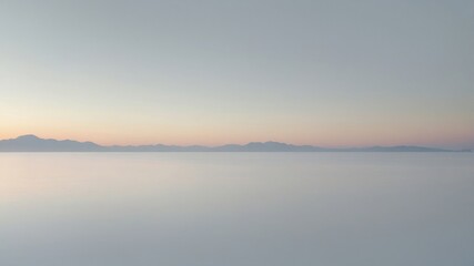 A serene minimalist landscape at dusk with soft pastel colors, featuring distant mountains and a tranquil, reflective foreground.