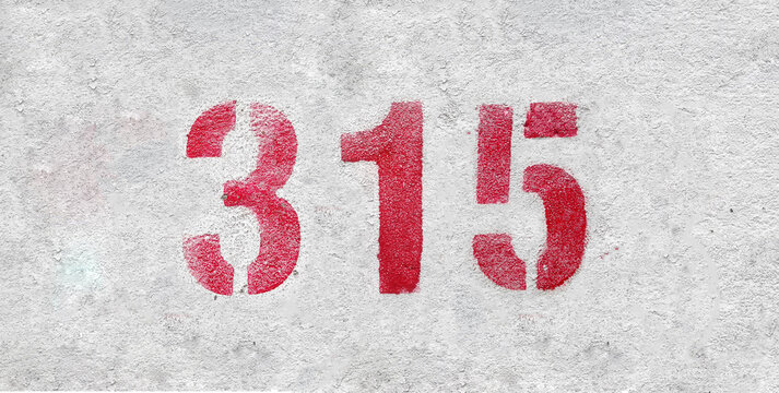 Red Number 315 on the white wall. Spray paint.