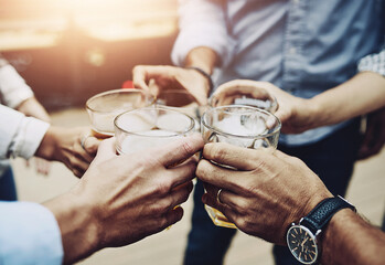 Business people, hands and glasses for toast to success, solidarity and team to celebrate goals....