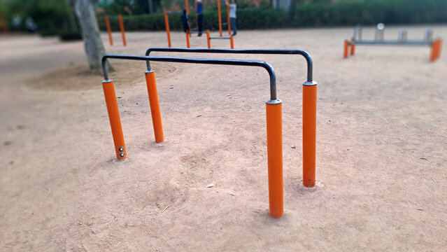 Outdoor calisthenics park with parallel bars for fitness training