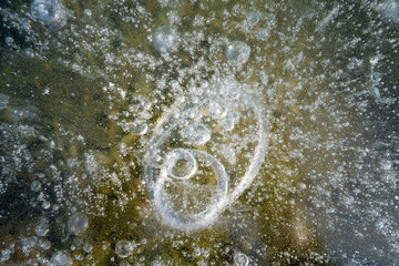 Bubbles in the ice layer, close-up photo