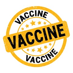 VACCINE text written on yellow-black round stamp sign.