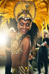 Feathers, dancer and woman for celebration, carnival and costume for samba. Performance, Mardi Gras and culture in Brazil for female person and festival of life, concert and local show for fun