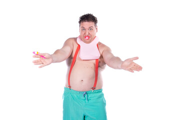 Funny fat man portrays a child with a pacifier. White background.