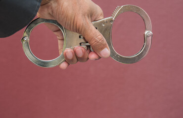 Police demonstrate the use of handcuffs