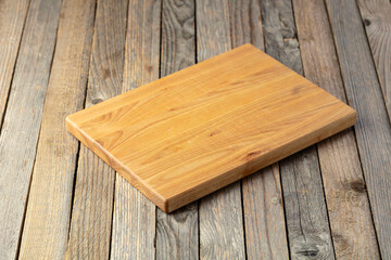 Cutting board on a wooden table.