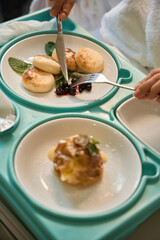 Close up of woman patient eating in bed in clinic