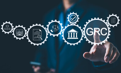 GRC Governance Risk Compliance Concept. Businessman with GRC governance, risk, compliance icons,...