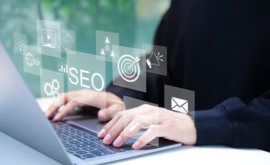 SEO Search Engine Optimization. A man using a laptop with SEO and digital marketing icons, online marketing strategies, and technology. optimizing website to rank in search engines. traffic on web,