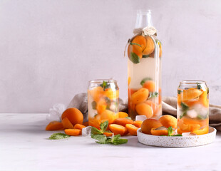 summer drink apricot lemonade with ice and mint