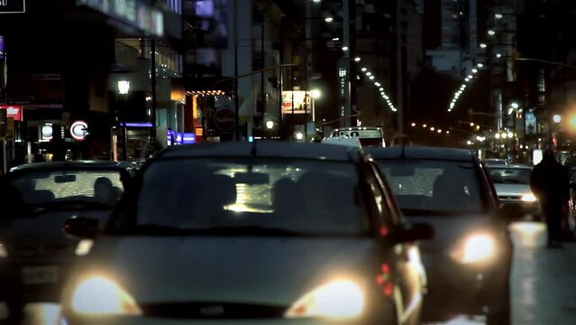 Corrientes Avenue View During a Rainy Night in Buenos Aires, Argentina. 4K Resolution.