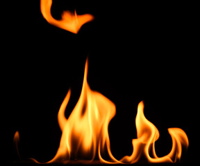 fire on a black background, burning and hot flames, close view