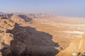Fototapeta premium The tall cliff on the edge of Judean desert and rocky desert in the east of Israel, on the border with Palestine. 