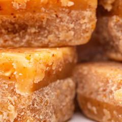 Creamy, crumbly and decadent fudge tasty, sweet, dessert, treat, confectionery, indulgent. On a white isolated background with copy space.