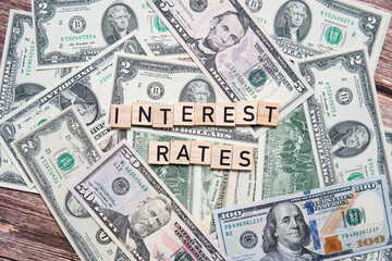 The inscription interest rates on the background of American dollars. Concept showing interest rate...