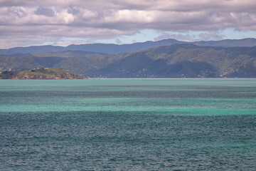 Exposure of the beautiful water color in Wellington Harbour, after crossing the Cook Strait and before arriving by boat to Wellington and pass the Pencarrow Head, New Zealand.
