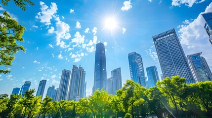 Obraz premium Stunning Modern Cityscape with Skyscrapers and Lush Greenery Under Bright Blue Sky