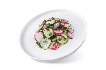 Seaweed radish cucumber salad in a plate on a white isolated background