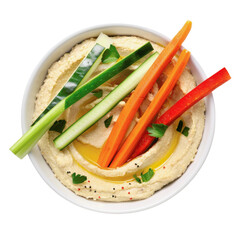 A bowl of hummus with carrots and cucumbers