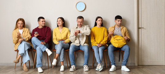 People waiting for their turn in room