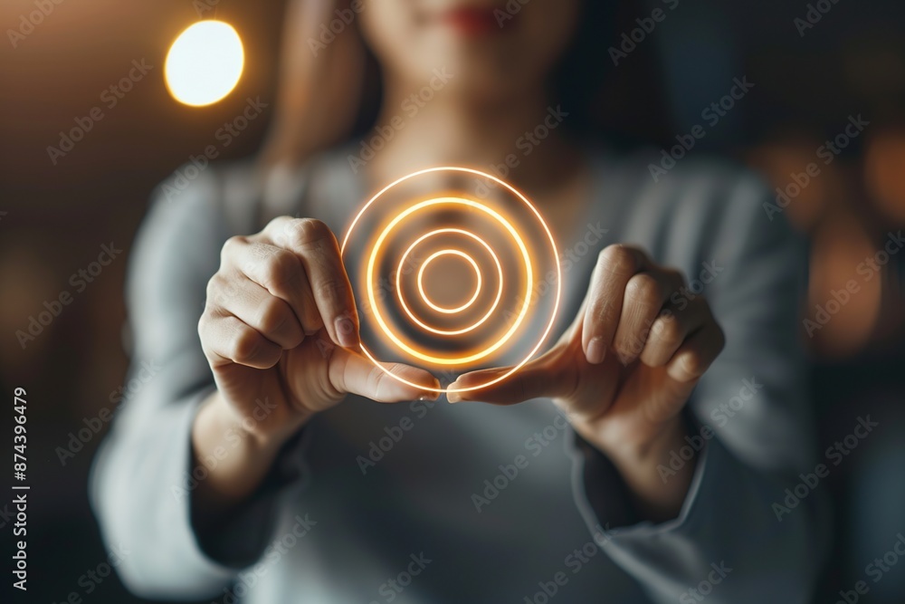 Poster capture the essence of ambition and empowerment with an image of a businesswoman holding a target ic