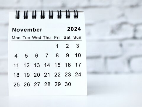 November 2024 white monthly desk calendar on a table