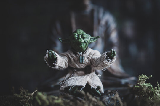 NEW YORK USA, JULY 7 2024: Jedi Master Yoda meditating with the Force in a zen pose - Hasbro action figure