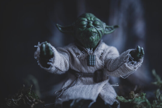 NEW YORK USA, JULY 7 2024: Jedi Master Yoda meditating with the Force in a zen pose - Hasbro action figure