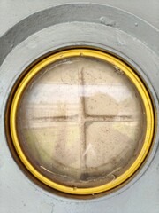 Compass. The device for the instruction of a direction in a gold frame, compass and magnifying glass gold color on the old map with coins, Detail of an antique maritime bronze solar compass.