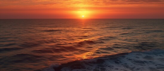 Fototapeta premium Sunset Over the Ocean Waves