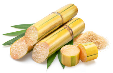 Sugarcanes stalks with sugar cane leaves and pile of sugar isolated on white background.