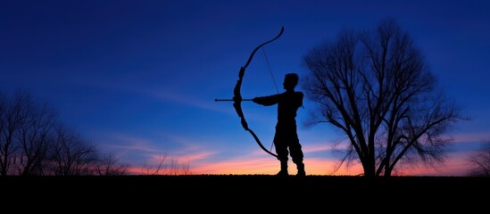 Silhouette of an Archer at Sunset