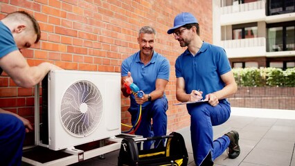 Professional HVAC technician performing a commercial air conditioner