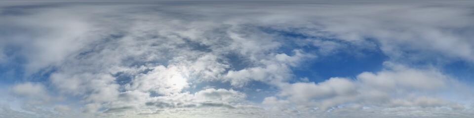 blue sky with haze in 360 hdri panorama in equirectangular format with zenith and clouds and sun for use in 3d graphics or game development as skydome or edit drone panoramas or sky replacement