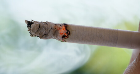 Smoking a cigarette, unhealthy lifestyle