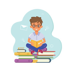 Boy sitting on books and reading a book