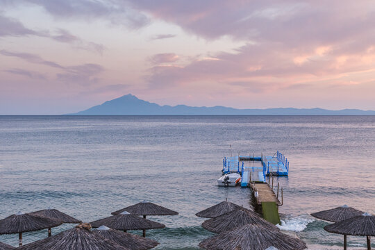 Beautiful sunset colors on the sea on the island of Thassos. Mount Athos can be seen in the distance.