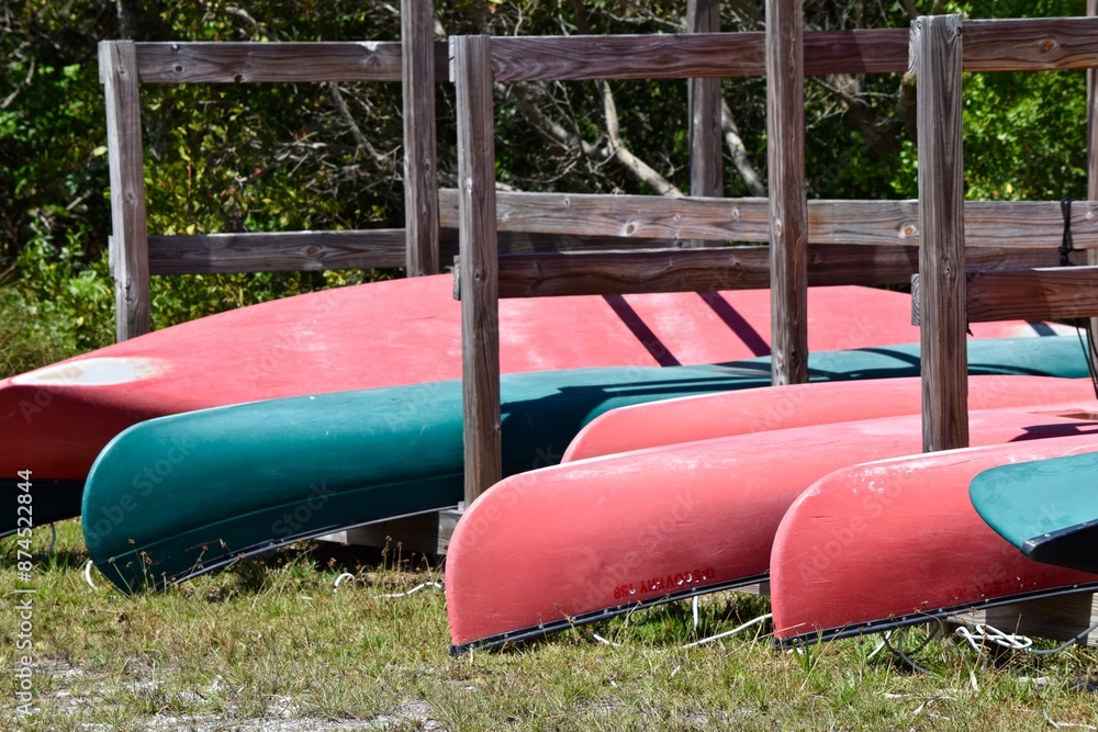 Wall mural canoe livery boats on rack