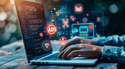 Fototapeta premium Hands coding on laptop with cyber security and digital advertising icons