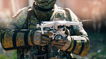 Concept modern war with technology UAV robots. Army operator in FPV glasses launches drone with...