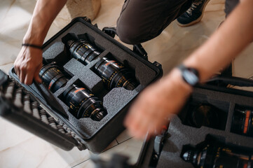 Film set, monitors and modern shooting equipment. Cinema optics in cases