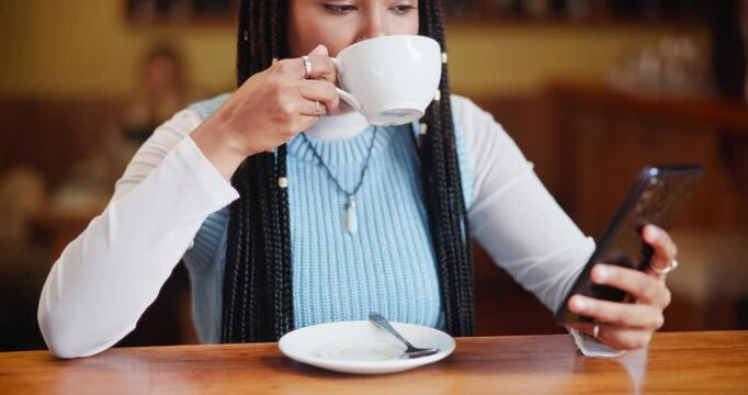 Black woman, cafe and drinking coffee with phone for communication or reading news at indoor restaurant. Closeup or hands of young African or female person on mobile smartphone with caffeine at shop