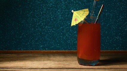 Ruby red alcoholic drink being spiked with a drug using eye dropper mockup rustic nightclub setting copy space 