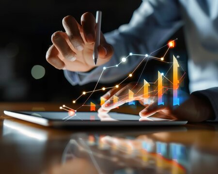 Businessman analyzing sales data on tablet for effective digital marketing strategy implementation