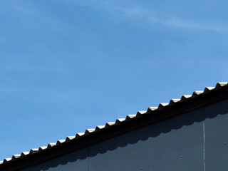 metal roof tiles with blue sky background